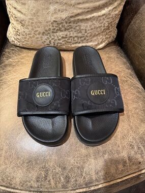 Authentic Gucci Black Slides with Gold Logo Medallion